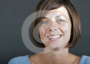 A smiling mature brunette woman