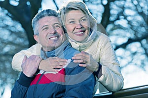 Smiling mature couple relaxing in park