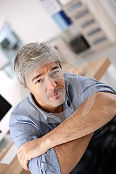 Smiling mature man at office