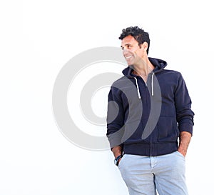 Smiling mature man standing against white background