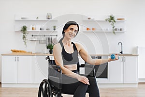 Smiling mature person increasing endurance while doing exercise with disability.