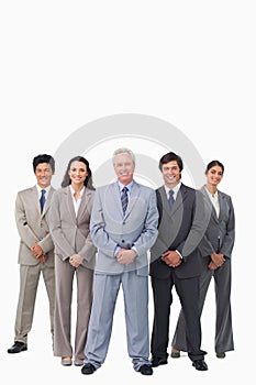 Smiling mature salesman standing together with his team
