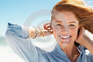 Smiling mature woman at beach