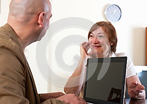 Smiling mature woman discussing