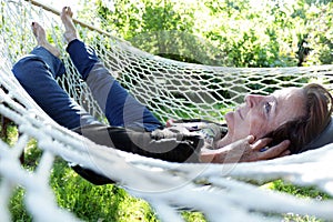 smiling mature woman in hammock