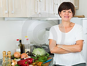 smiling mature woman kitchen