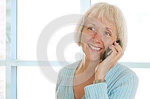 Smiling Mature Woman Talking On Cell Phone