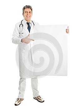 Smiling medical doctor presenting empty board