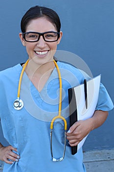 Smiling medical doctor with stethoscope. Over blue background