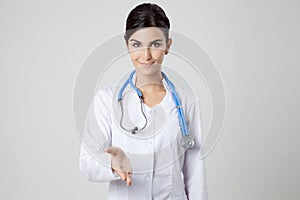 Smiling medical doctor woman with stethoscope.