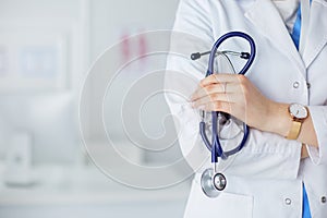 Smiling medical doctor woman with stethoscope in hospital