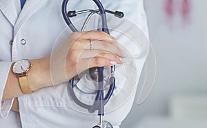 Smiling medical doctor woman with stethoscope in hospital