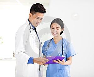 Smiling Medical doctors working in the office