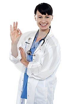 Smiling medical practitioner showing perfect sign