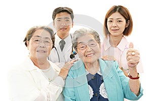 Smiling medical staff with old women