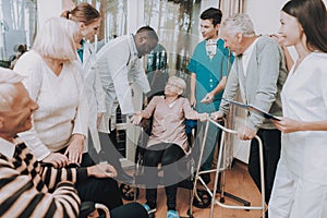 Smiling Medical Staff . Patient with Walker .