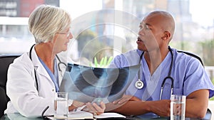 Smiling medical team looking at an xray