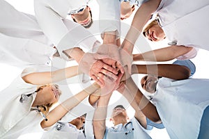 Smiling Medical Team Stacking Hands