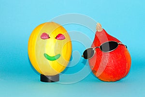 smiling melon and pumpkin with glasses, modern posers, creative concept