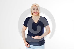 Smiling middle age woman holding something imaginary on palm of her hand, Happy beautiful woman showing copyspace or something