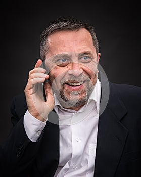 Businessman speaks on a mobile phone