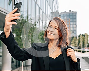 Smiling middle-aged businesswoman with ginger hair