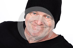 Smiling Middle-Aged Man in Black T-Shirt and Hat, Confident Portrait on White Background - Casual Lifestyle and Fashion for Mature