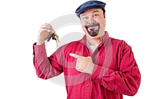 Smiling middle aged man pointing at car keys