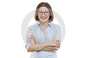 Smiling middle aged woman with folded arms on white background, isolated.