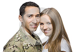 Smiling Military Couple Pose for a Portrait