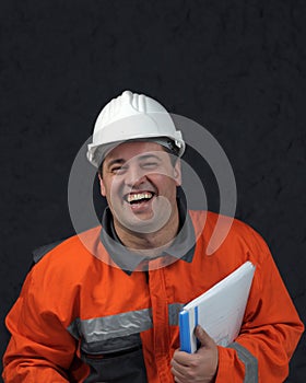 Smiling mine worker with file