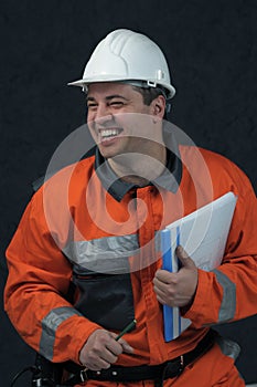 Smiling mine worker with file