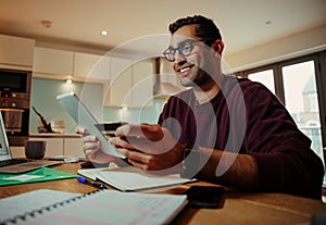 Smiling mixed race businessman holding digital tablet holding credit card making online purchase