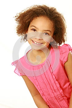 Smiling mixed race girl looking at camera