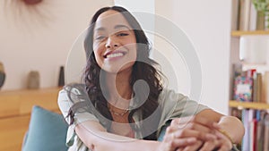 Smiling mixed race woman looking at camera