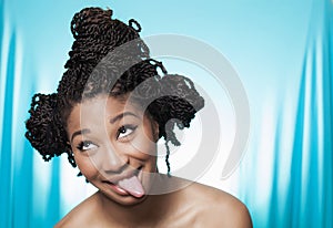 Smiling model with tongue stuck out