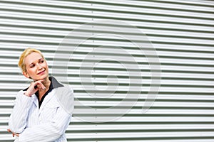 Smiling modern business woman looking at copyspace