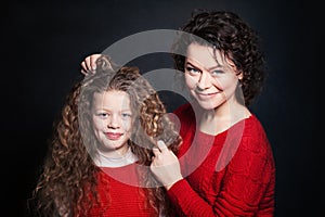 Smiling Mother and Daughter with Long Curly Hair