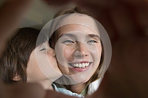 Smiling mother and small son demonstrate love