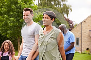 Smiling Multi-Generation Mixed Race Family In Garden At Home Together