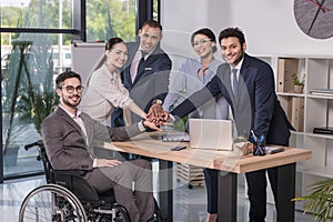 smiling multicultural business team looking at camera photo