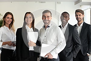 Smiling multiracial professional business team looking at camera, portrait