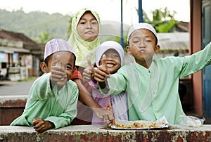 Smiling muslim children in bali indonesia