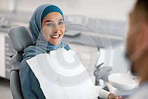 Smiling Muslim Lady In Hijab Having Check Up In Modern Dental Clinic