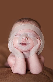 Smiling newborn baby