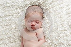 Smiling newborn baby