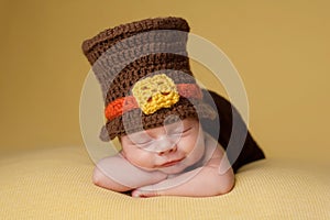 Smiling Newborn Baby Boy Wearing a Pilgrim Hat