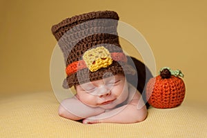 Smiling Newborn Baby Boy Wearing a Pilgrim Hat