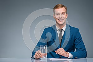 Smiling newscaster during broadcasting