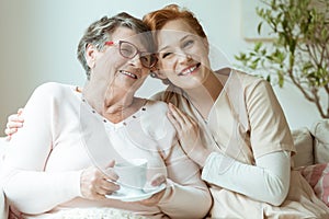 Smiling nurse in beige uniform